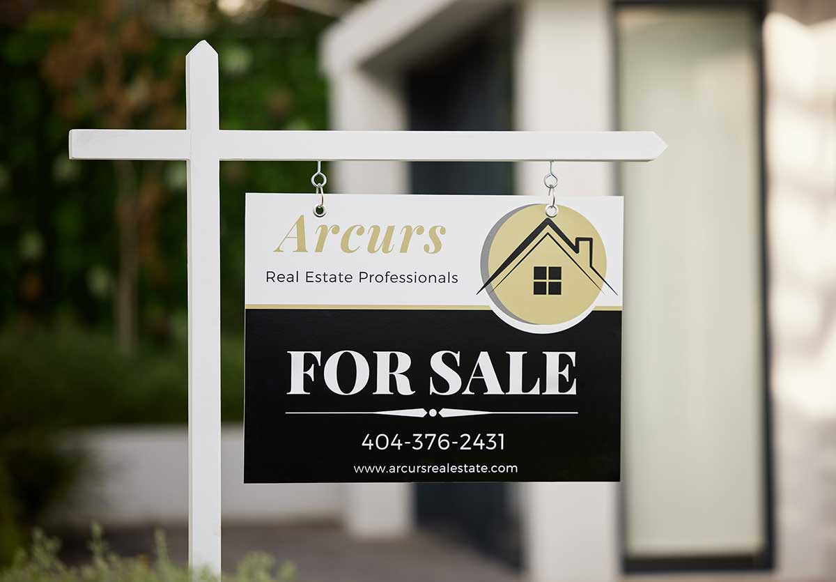 For Sale signs on a yard For Sale signs on a yard